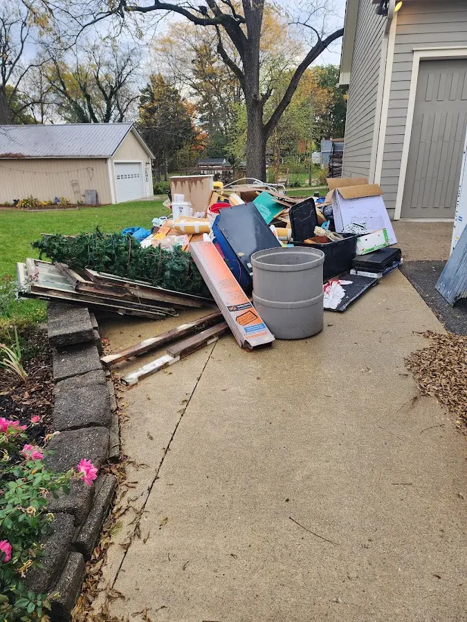 Dumpster being loaded with debris for Commercial Dumpster Rental in Village of Oak Creek (Big Park)